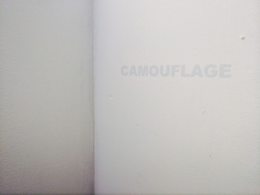 White vinyl text on wall