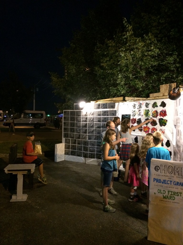 Youth and parents looking at the work during the festival. 